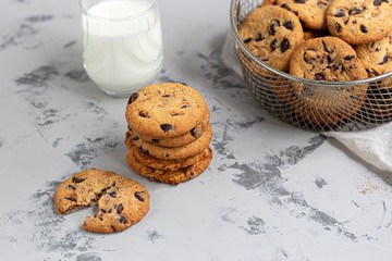 Chocolate Chip Cookies. Homemade baking. Round shape, not big. On a light gray background.