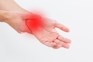 man's wrist hurts. A damaged female hand hurts. Hands suffer from work, sports injury. Sore spot is highlighted in red. Isolated white background.