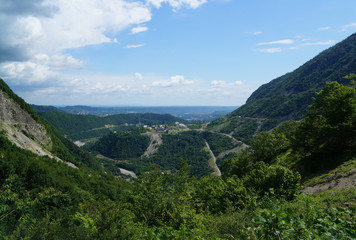 Fototapeta na wymiar View from the mountain. Georgia serpentine. winding road in the mountains