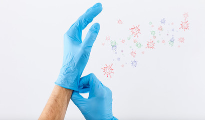 Doctor putting on protective gloves, isolated on white