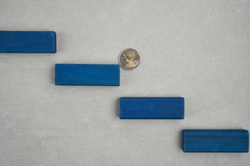 stairs made by blue bricks with two euro coin