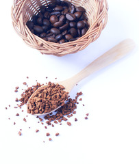 Freeze dried coffee., Wooden spoon with granulated Instant Coffee., close-up on white background.