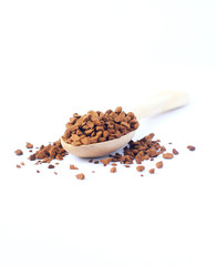 Freeze dried coffee., Wooden spoon with granulated Instant Coffee., close-up on white background.