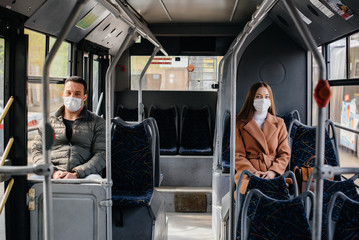 Passengers on public transport during the coronavirus pandemic keep their distance from each other....