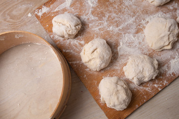 Female hands mixing dough in the home kitchen.