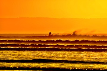Sunset Obver Windy Surf With