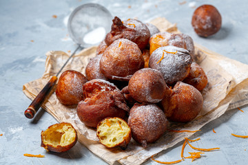 French doughnuts sprinkled with powdered sugar.