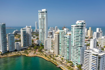 Fototapeta na wymiar Aerial View of the hotels and tall apartment buildings near the Caribbean coast. Modern City Skyline.