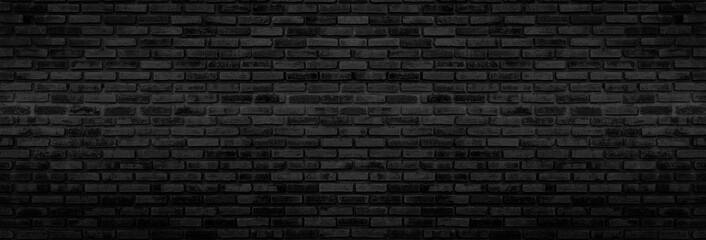 Panorama Black brick walls that are not plastered background and texture. The texture of the brick is black. Background of empty brick basement wall.