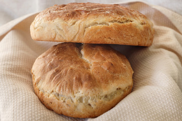 Fresh homemade wheat bread on  wooden table.