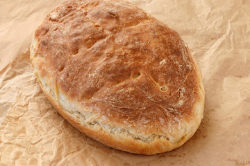 Fresh homemade wheat bread on  wooden table.