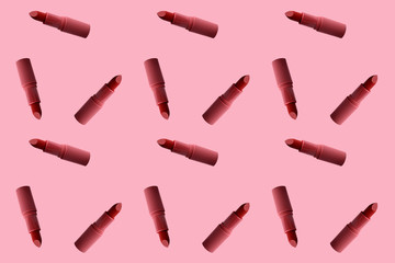 sample background texture of many tubes of lipstick in pop art style on a pink background, concept...