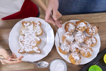 Fresh baked homemade muffins on table sprinkled with sugar bubble