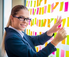 Beautiful female employee with many conflicting priorities