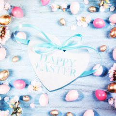 Easter background, spring flowers with easter eggs