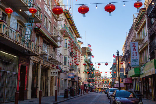 San Francisco, USA - May 2018: Buildings with Chinese lanterns decoration and flags in famous Chinatown district in San Francisco, California
