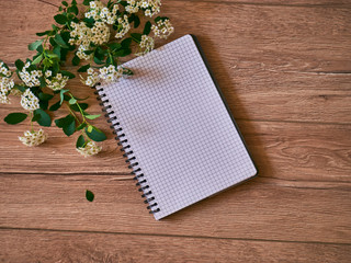 Top view of open blank notebook, bouquet, flower. Travel and adventure concept, journey diary