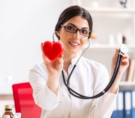 Young doctor in heart care concept