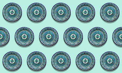 Rhythmic pattern: traditional Asian plates on a light green background