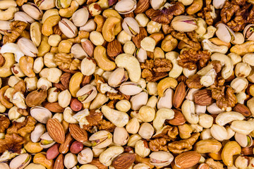 Background of the various nuts (almond, cashew, hazelnut, pistachio, walnut). Vegetarian meal. Healthy eating concept