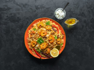 Traditional Indian Biryani with shrimp. Tasty and delicious prawns biryani, top view