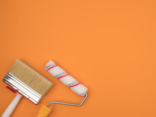 A paint roller and a large brush on an orange background.