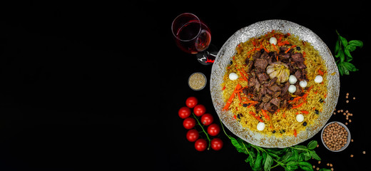 Samarkand pilaf with wegetables. on the black space background