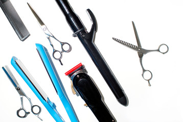 Professional combs and different hairdresser tools on white background top view. Copy space