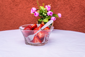 glass jar with lots of beautiful red strawberries