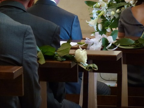 Rear View Of People In Church During Wedding