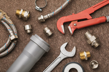 Various plumbing tools for connecting faucets and sewers, top view