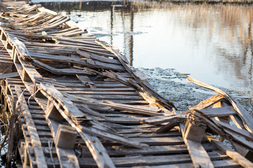 Wooden Pallet Bridge. bridge made of old wooden pallets. slum bridge over the river