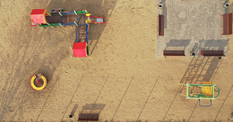 A closed playground for children with tape during the COVID-19 pandemic, Coronavirus. Aerial view