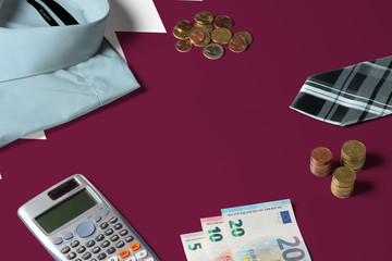 Qatar flag on minimal money concept table. Coins and financial objects on flag surface. National economy theme.