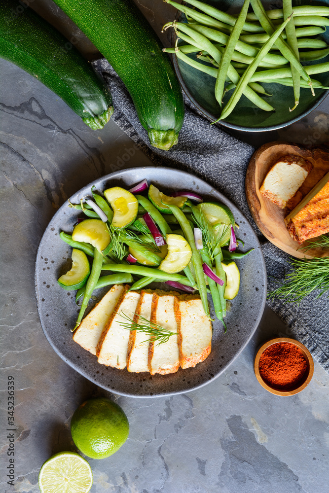 Sticker Marinated tofu slices served with blanched green beans and zucchini, drizzled with olive oil and decorated with fresh dill - Stickers