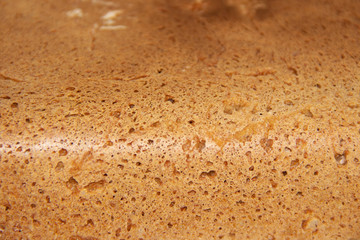 Bread with wheat seeds, close-up with a pleasant warm shade