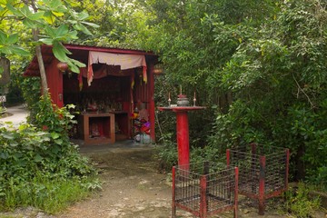 Buddhist Red Wayside Shrine on Tropical Pulau Ubin Island, Singapore