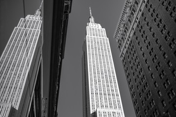Low Angle View Of Empire State Building Reflecting On Glass