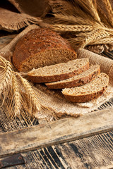 Fototapeta na wymiar Fresh homemade rye loaf of bread, rustic style