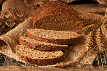 Freshly baked traditional rye bread on wooden table