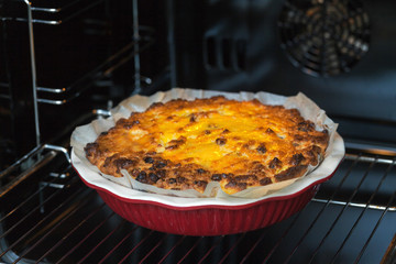 Oven baked cottage cheese casserole. In red baking dish