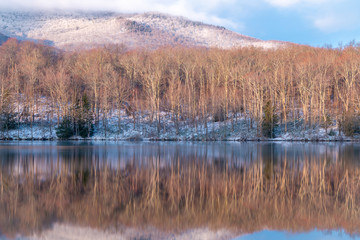 A view of an Adirondack lake early in the morning.  - 343245178