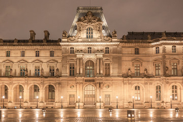 Fototapeta na wymiar The Louvre at night in Paris France