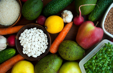 Vegan concept of a healthy balanced diet.  View from above. Health vegan food concept. Foods high in antioxidants, fiber, smart carbohydrates and vitamins.  A set of vegetarian products