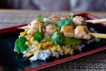 Teriyaki chicken with rice on restaurant table