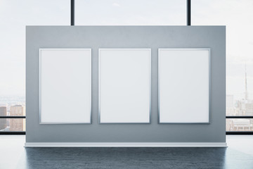 Contemporary gray gallery interior with three empty banners,