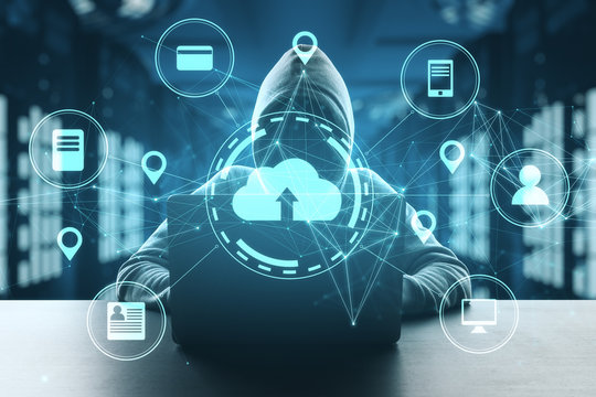 Hacker using laptop in server room with cloud computing diagram.