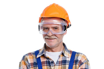 Portrait of old foreman smiling in his yellow hardhat smile on white  background