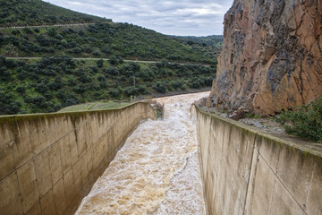 Reservoir J&aacute;ndula, expelling water after several months of rain, Jaen, Spain