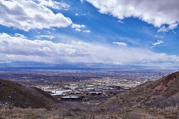 Salt Lake Valley and City panoramic views from the Red Butte Trail to the Living Room, Wasatch Front, Rocky Mountains in Utah early spring. Hiking view of trails around the University and Gardens and 